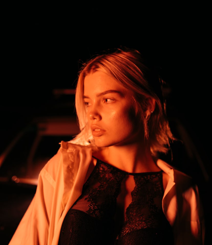 A woman in a dark shadow, an image representing the 12th house in astrology