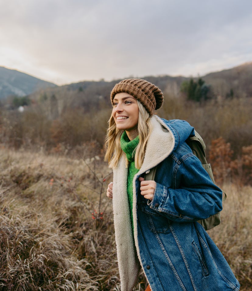 Young woman hiking to represent the earth signs: Taurus, Virgo, and Capricorn
