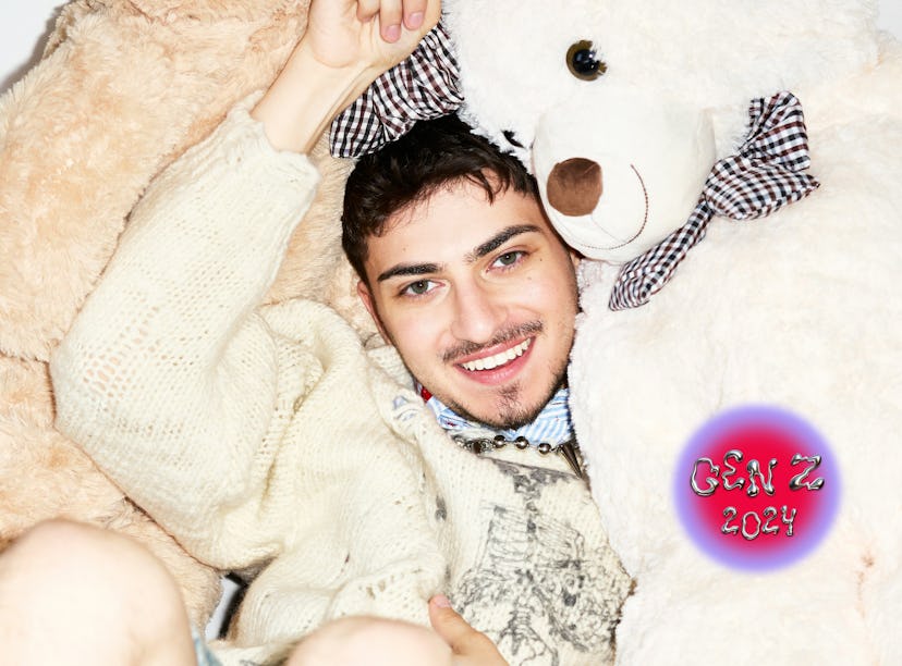 Harry Daniels posing with stuffed teddy bears.