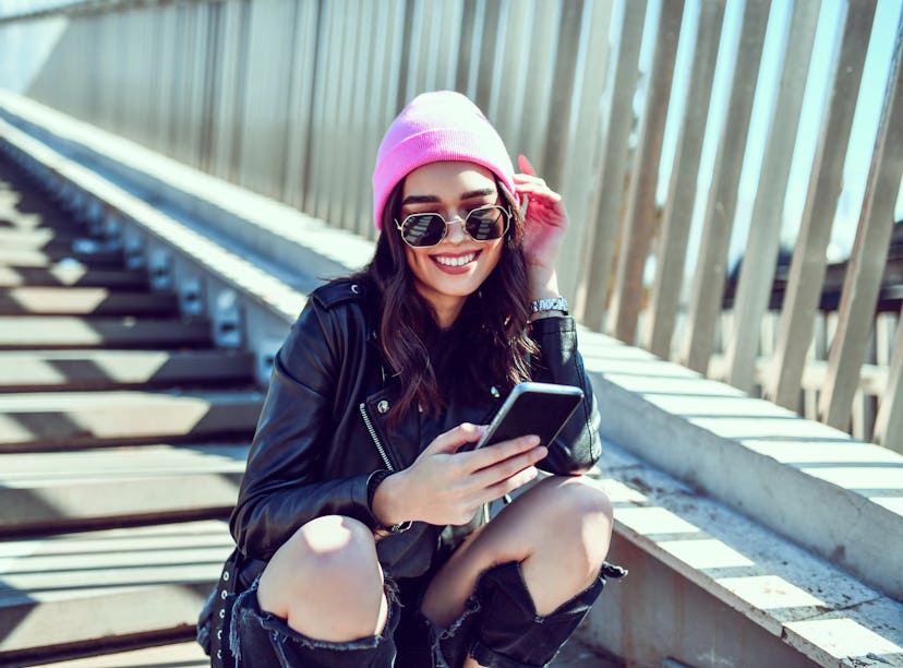 Girlfriend composing sweet long text message to her boyfriend.