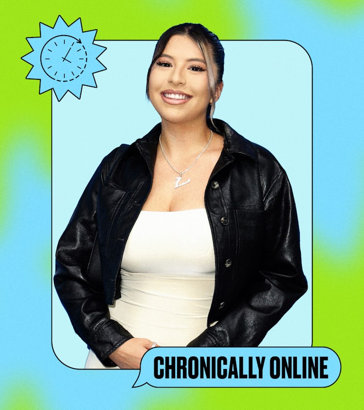 A smiling woman wearing a black jacket and white top stands in front of a light blue background, fra...