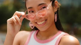 Young woman with a "good things take time" shirt during the North Node in Aries.