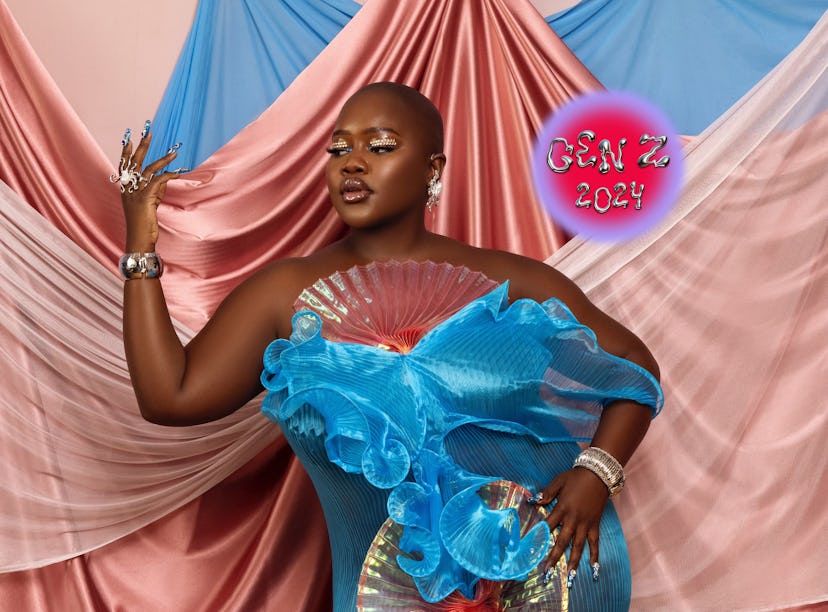 Achieng Agutu stands in front of draped pink and blue silks.