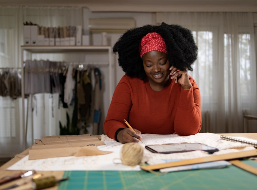 a woman maps out her career goals, which are represented in her 10th house of astrology