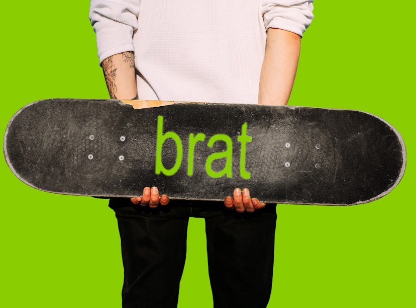man holding a Brat skateboard, a reference to Charli XCX's album
