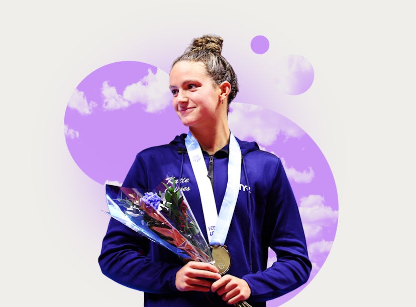 Female athlete in a blue jacket holding a medal and flowers, smiling against a purple abstract backg...
