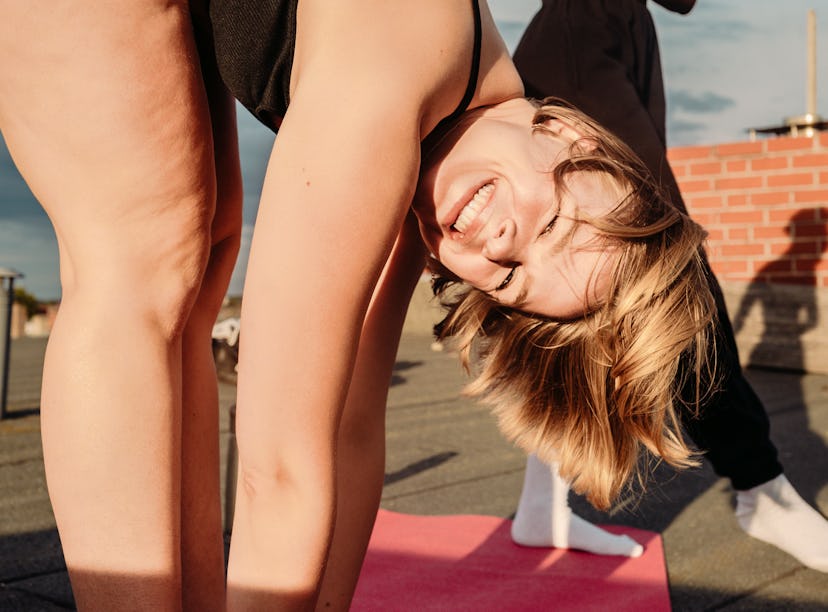 Young woman moving all her body parts, per her zodiac sign.