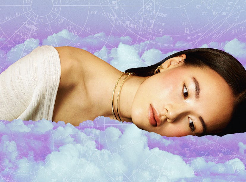 Young woman laying down, sulking after reading her March 2025 horoscope.