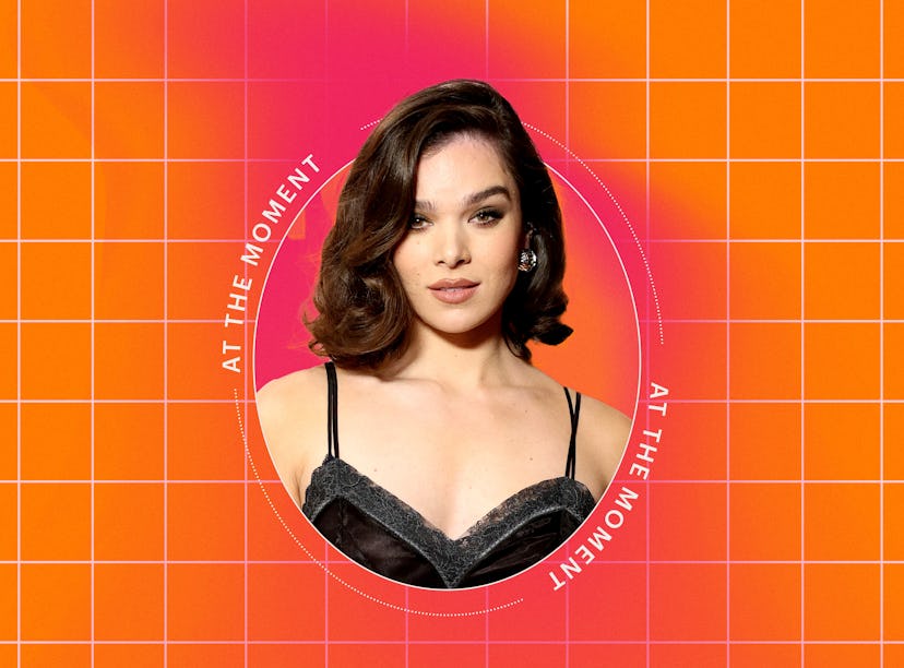 An image features a woman with wavy hair, wearing a black, stylish outfit, set against a bright oran...