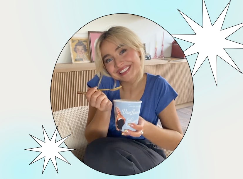 A smiling woman with blonde hair sits on a sofa, holding a yogurt cup with a spoon inside, framed in...